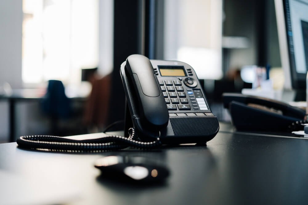 Office desk phone illustrating business phone system setup